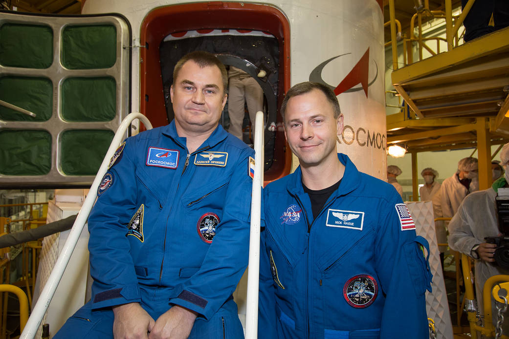 Expedition 57 crew members in front of the Soyuz MS-10 spacecraft