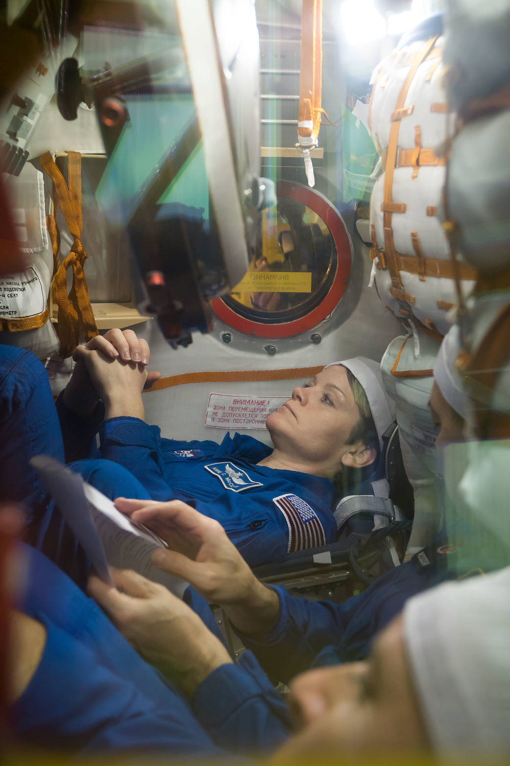 Astronaut Anne McClain runs through procedures in the Soyuz MS-11 spacecraft