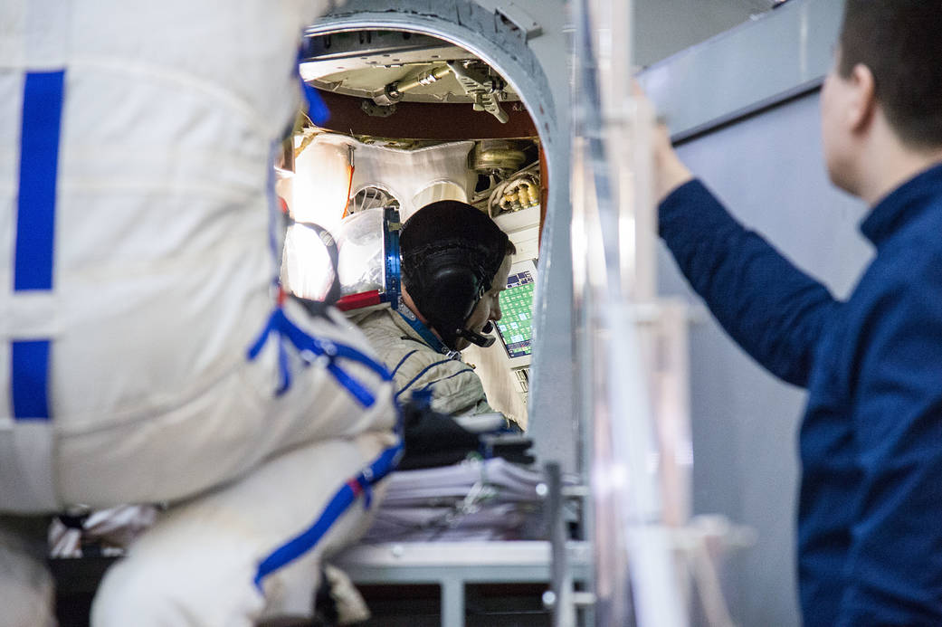Nick Hague of NASA inside a Soyuz spacecraft simulator