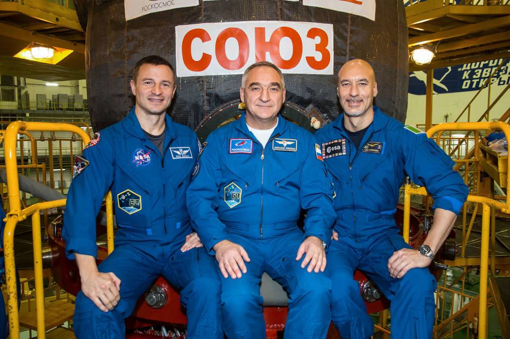 Expedition 59 backup crew members pose in front of the the Soyuz MS-12 spacecraft