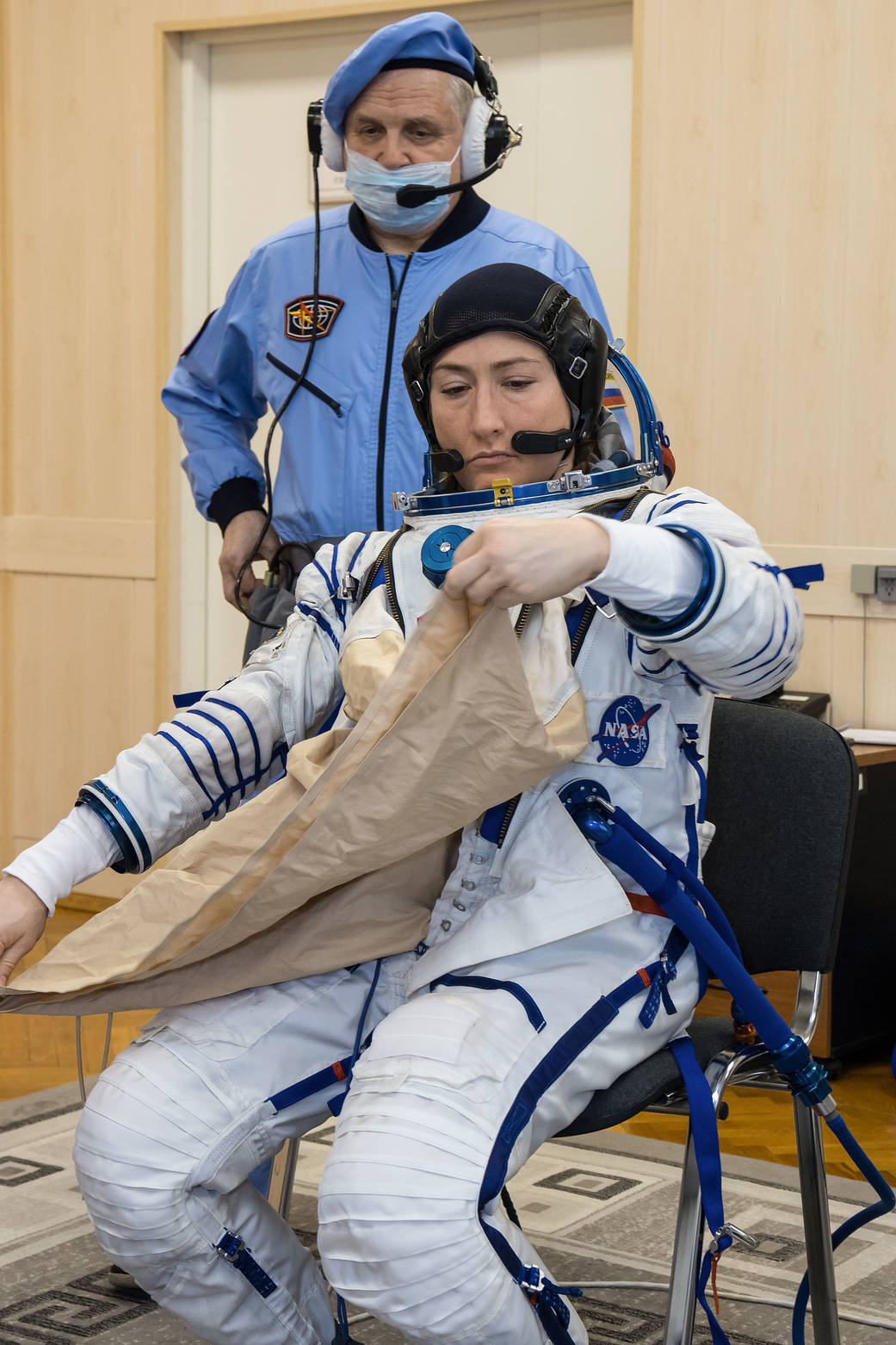 Christina Koch of NASA suits up for a Soyuz fit check