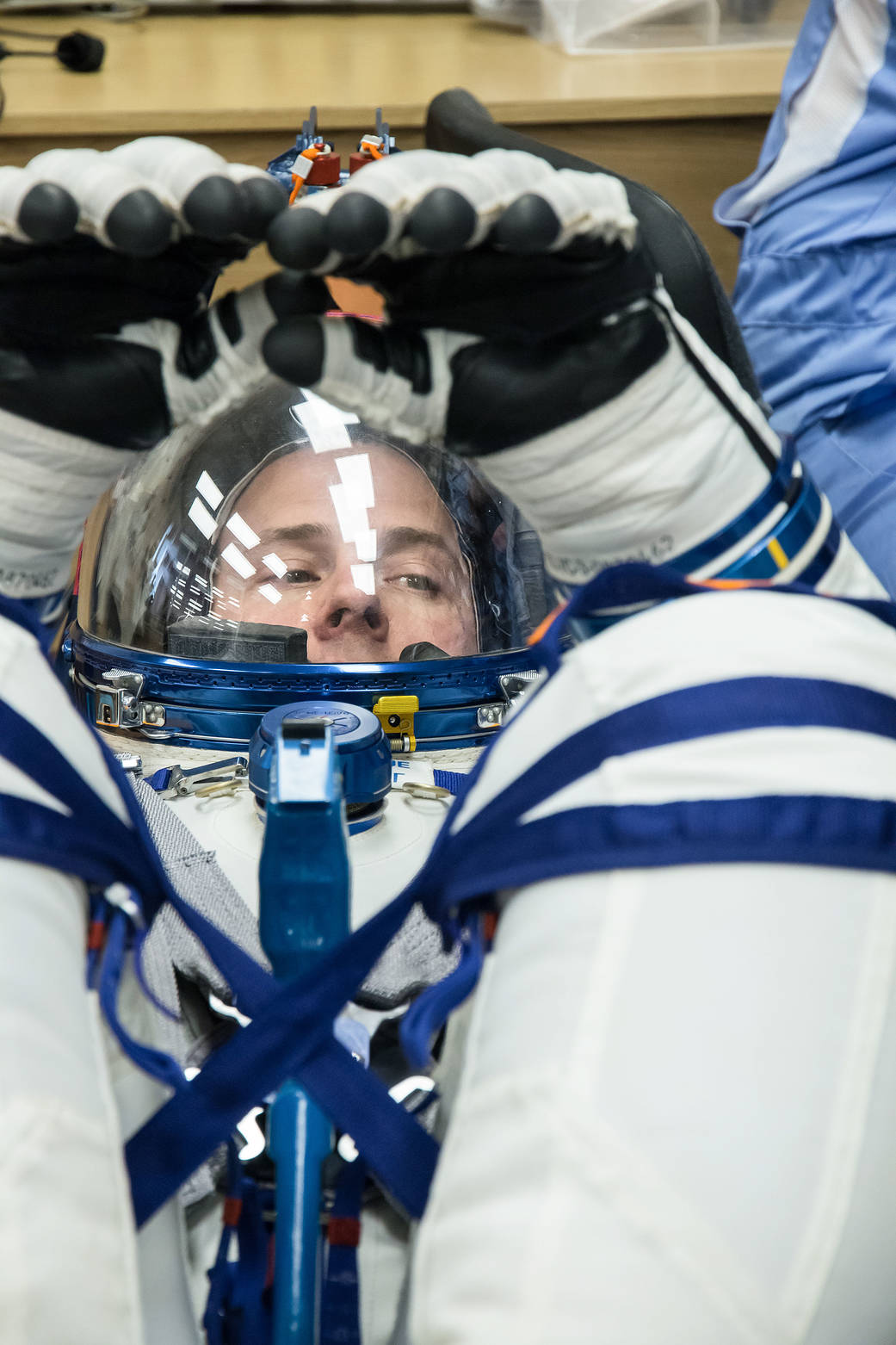 Nick Hague of NASA undergoes a Sokol launch suit pressure check