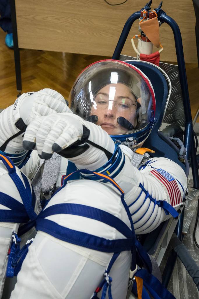 Christina Koch of NASA undergoes a Sokol launch suit pressure check