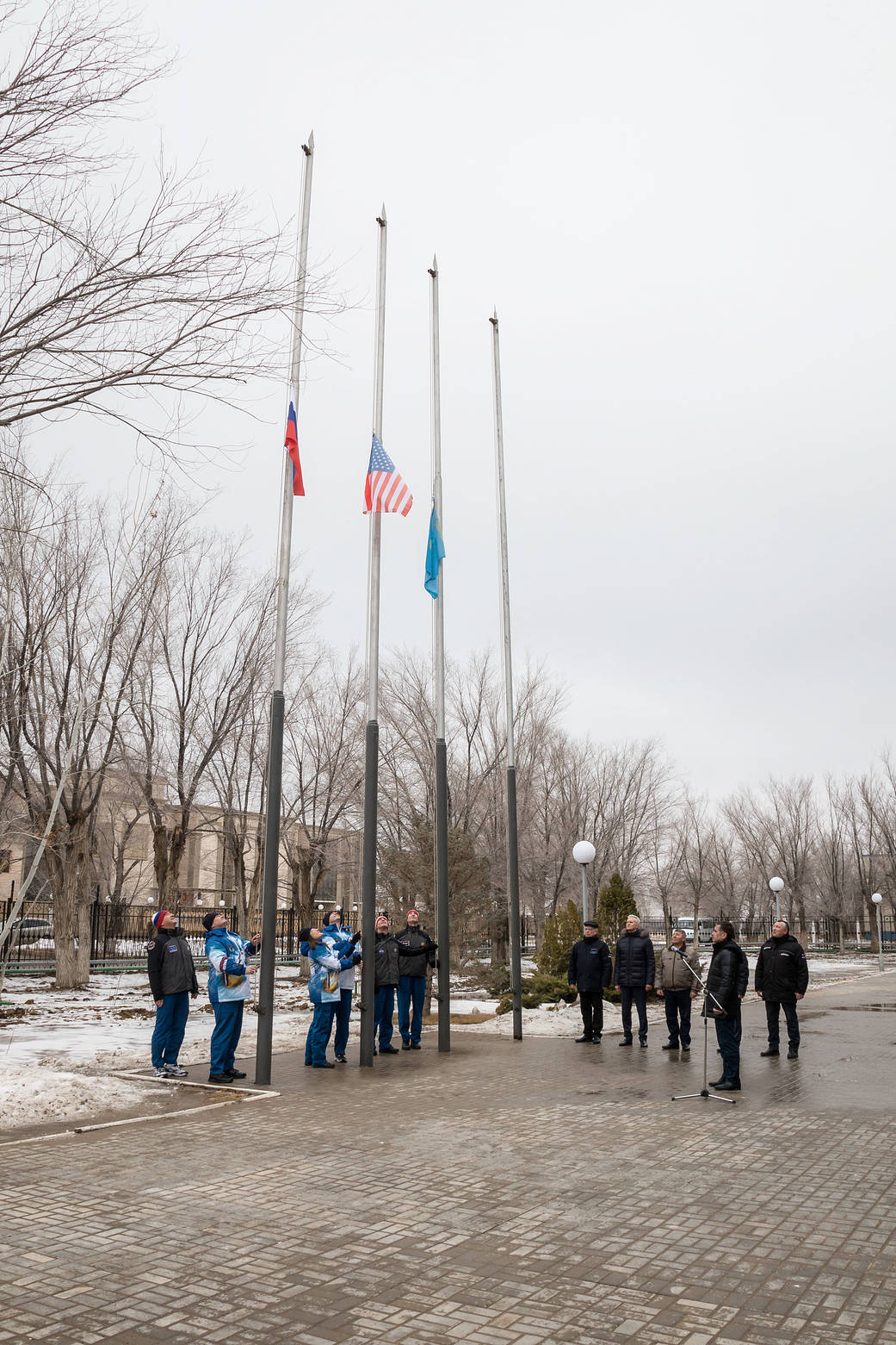 Expedition 59 prime and backup crew members raise of the flags of Russia, the U.S. and Kazakhstan
