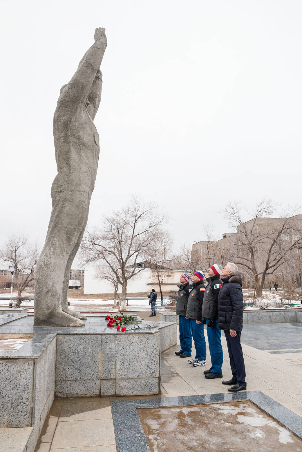 Expedition 59 backup crew members at the statue of Yuri Gagarin