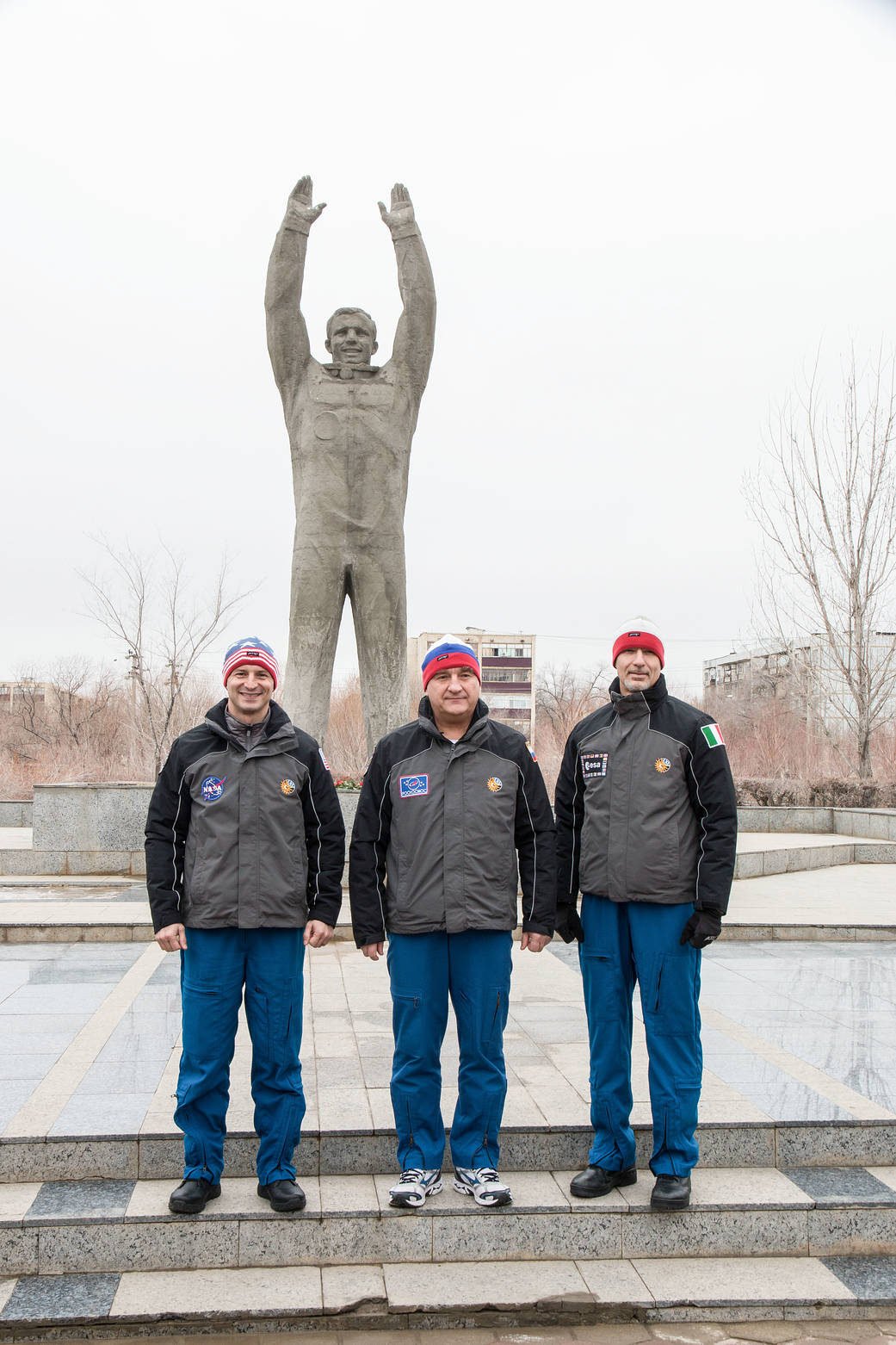 Expedition 59 backup crew members at the statue of Yuri Gagarin