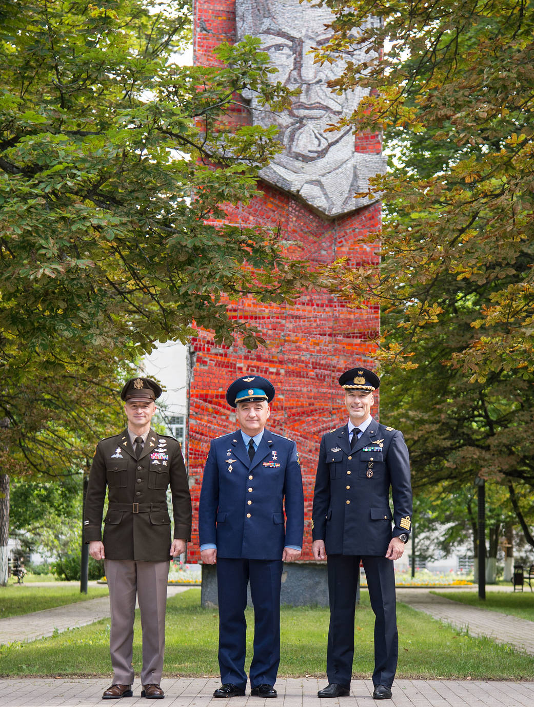 Expedition 60 crewmembers at the mural of Vladimir Lenin