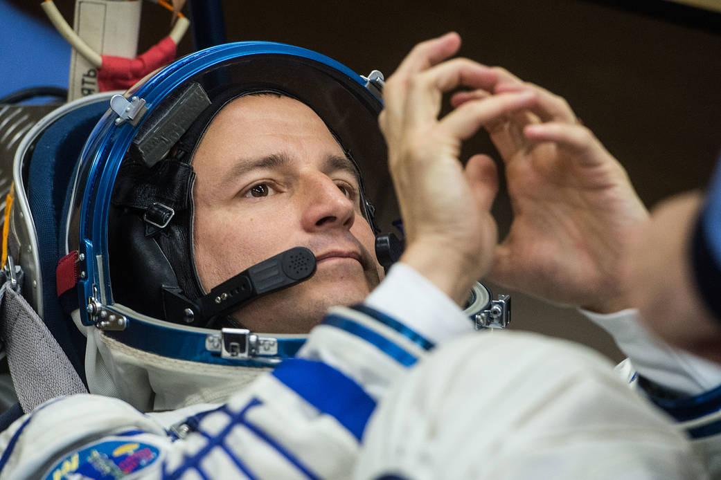 Expedition 60 crewmember Drew Morgan undergoes a Sokol launch and entry suit leak check