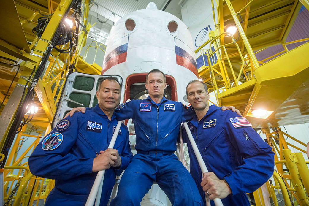 Expedition 60 backup crewmembers in front of the Soyuz MS-13 spacecraft