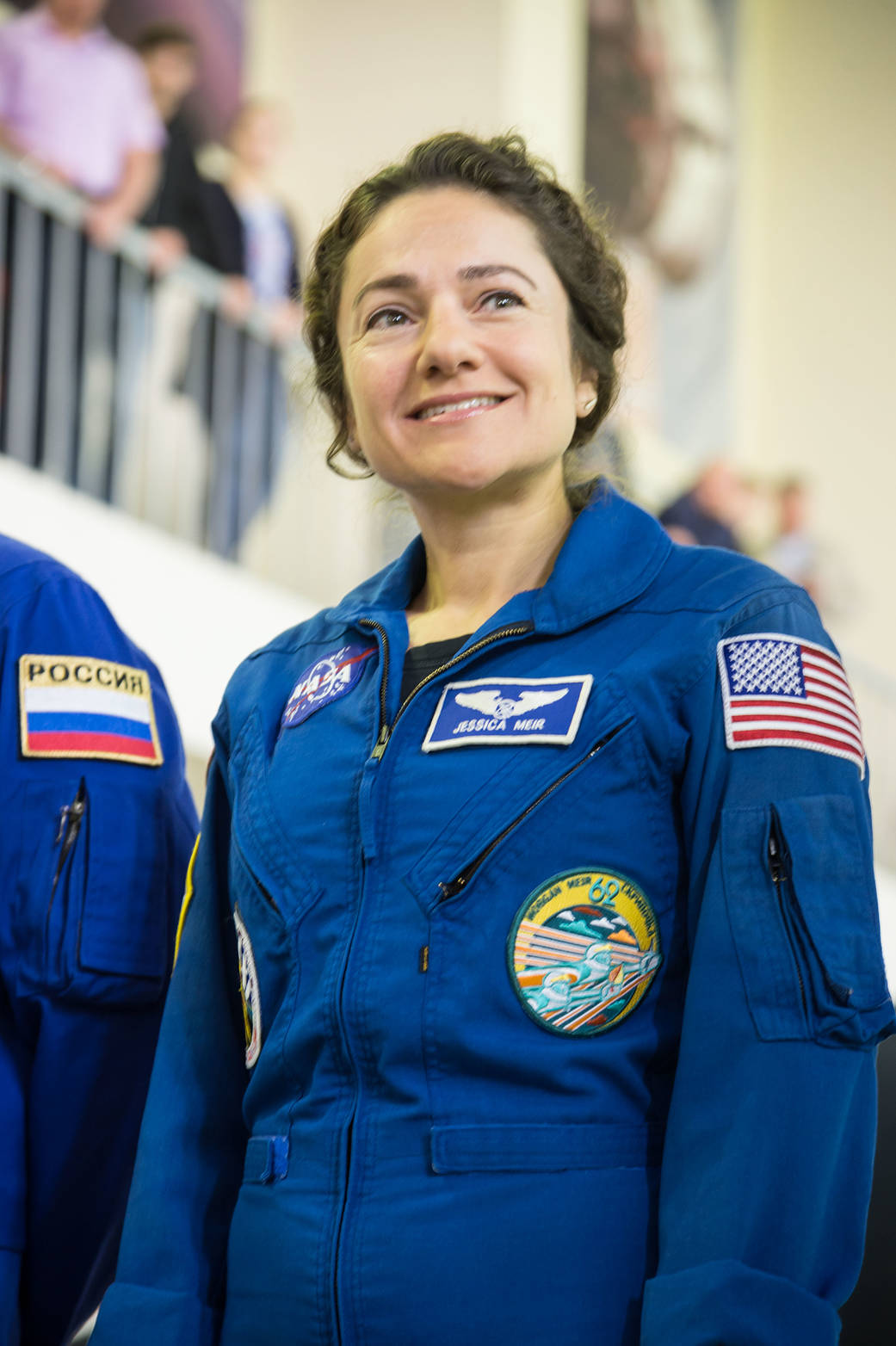 Expedition 61 crewmember Jessica Meir of NASA listens to a reporter's question during her final qualification exams.
