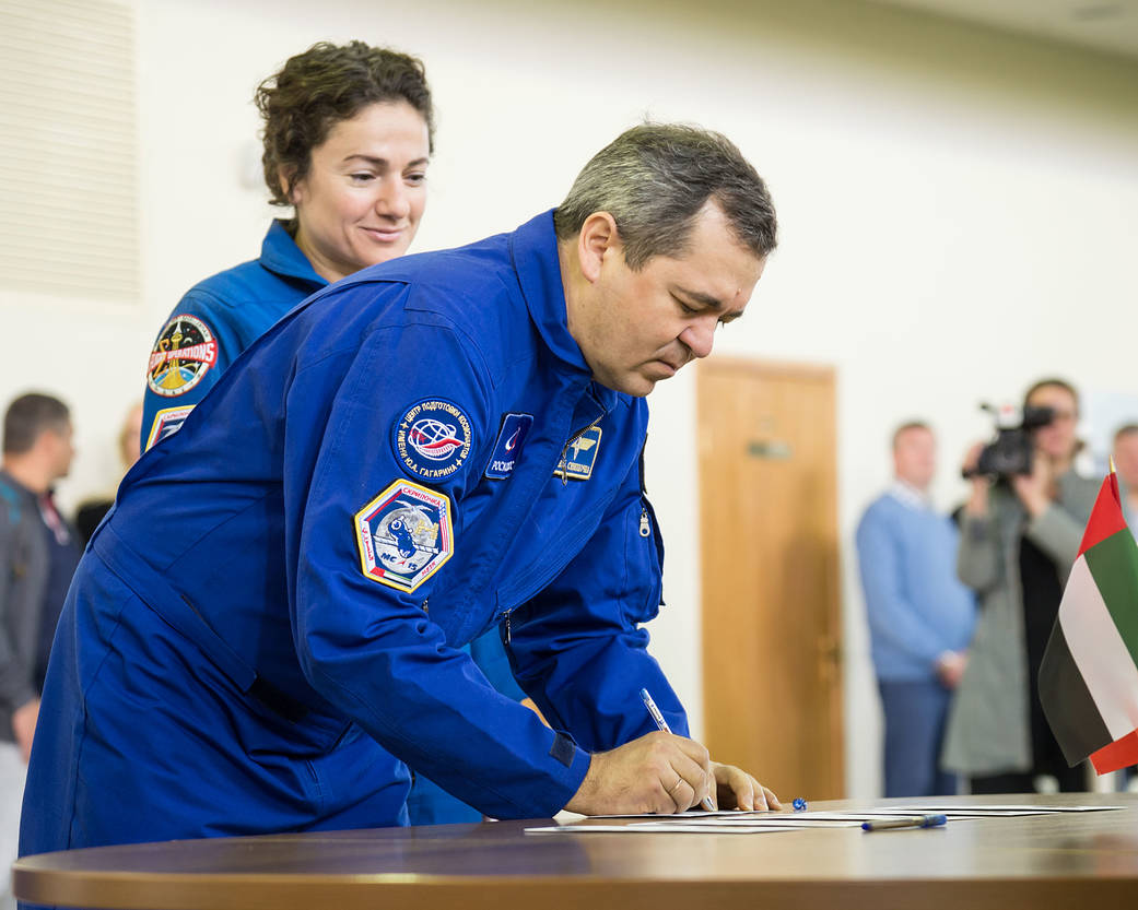 Expedition 61 crewmember Oleg Skripochka of Roscosmos signs in for the first day of crew qualification exams