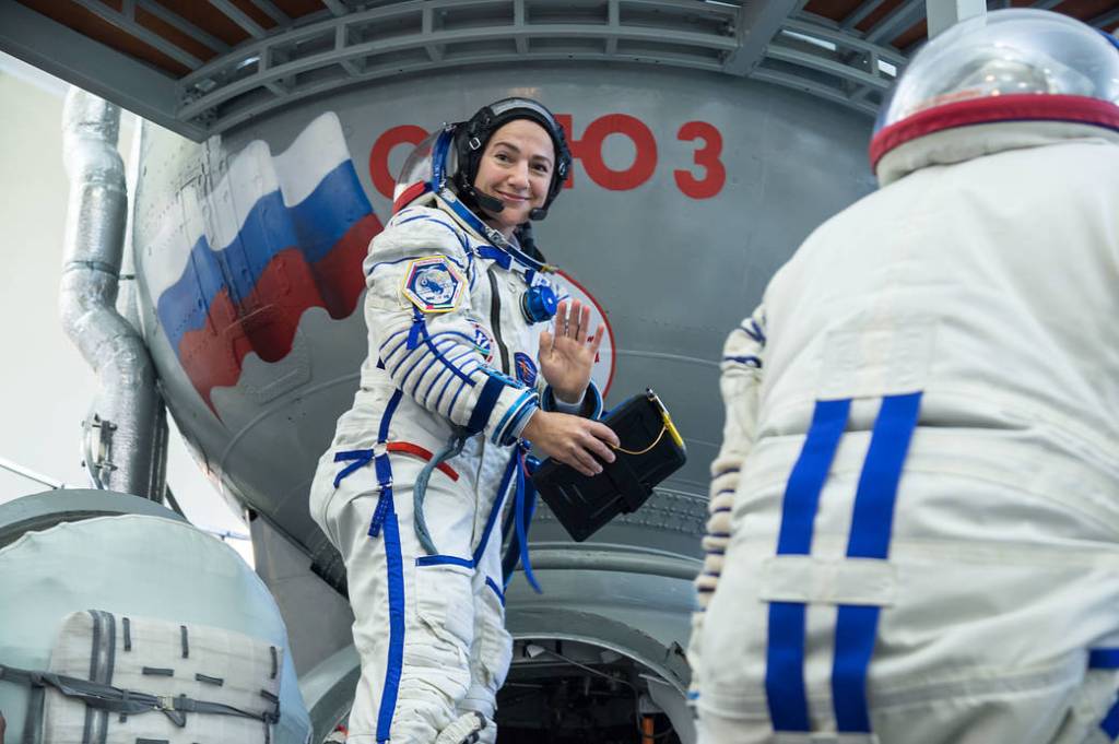 Jessica Meir climbs aboard a Soyuz trainer during final crew qualification exams