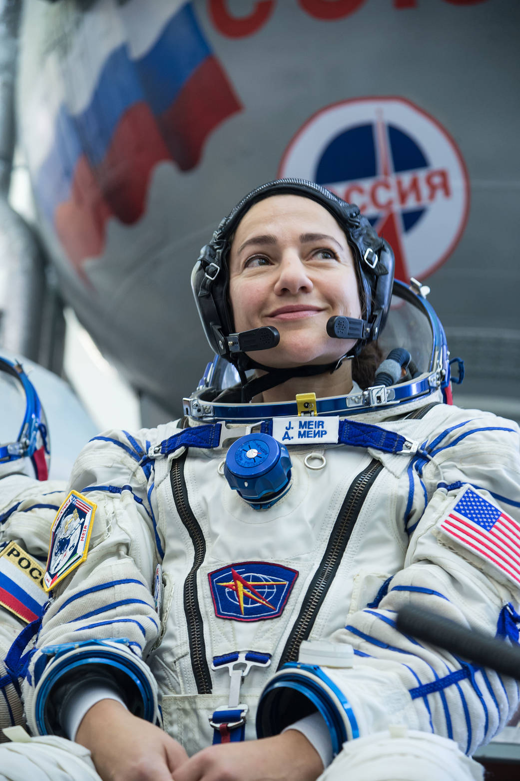 Jessica Meir listens to a reporter's question during final crew qualification exams