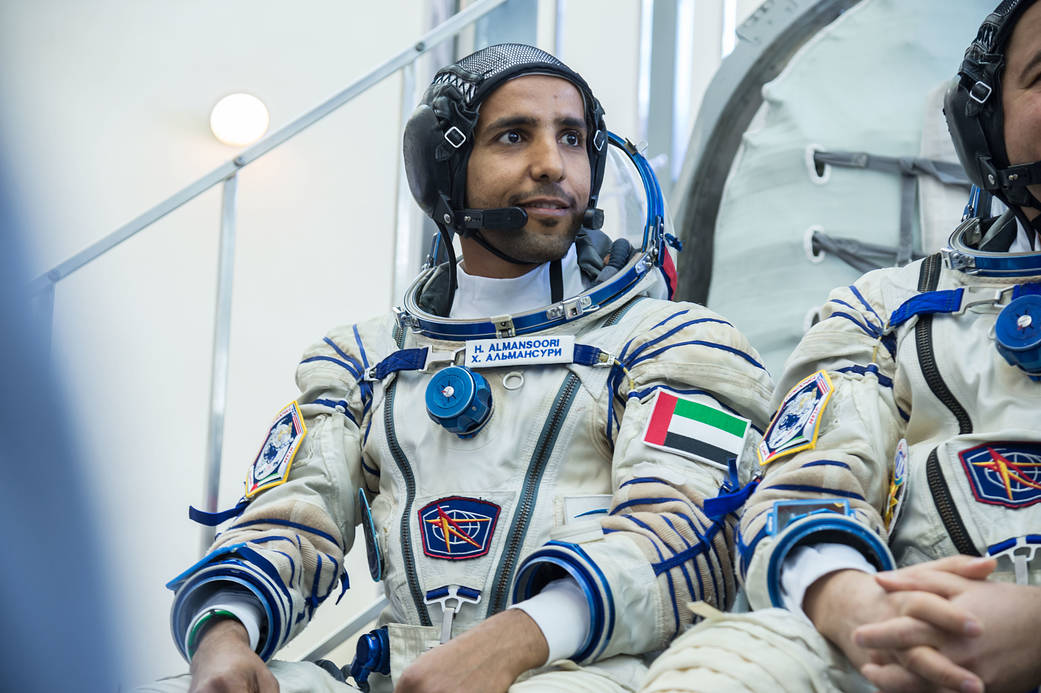 Spaceflight participant Hazzaa Ali Almansoori listens to a reporter’s question during final crew qualification exams