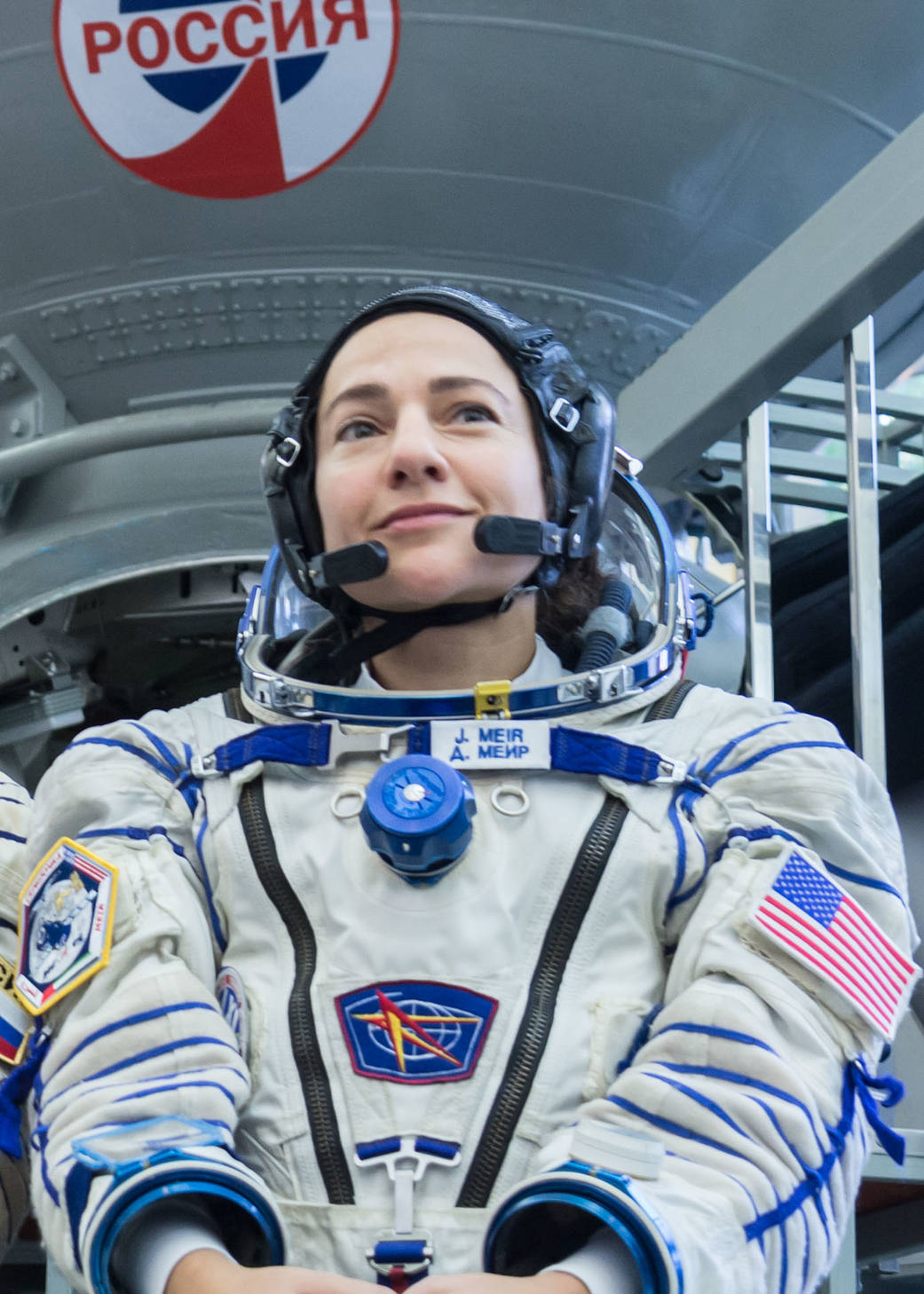 Jessica Meir of NASA listens to a reporter’s question during final crew qualification exams