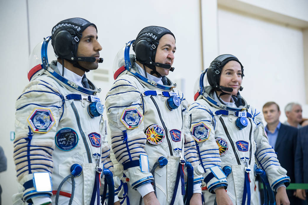 Spaceflight participant Hazzaa Ali Almansoori, Oleg Skripochka and Jessica Meir report for duty