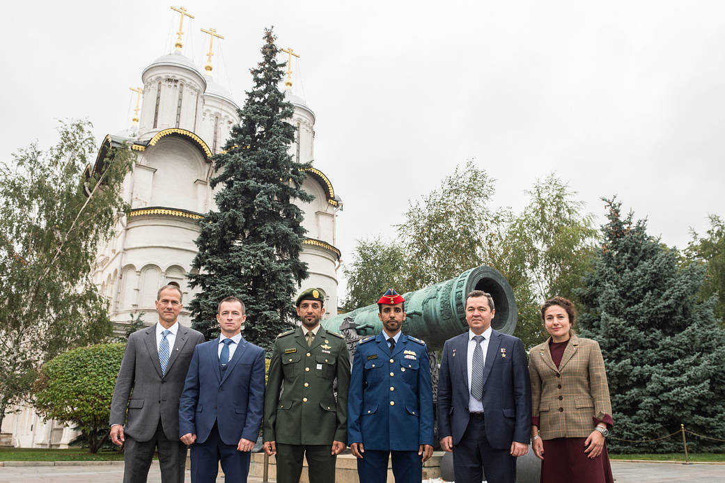 Expedition 61 prime and backup crewmembers pose for pictures in front of the Tsar Cannon