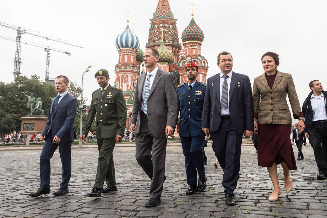 Expedition 61 crewmembers and their backups walk through Red Square in Moscow