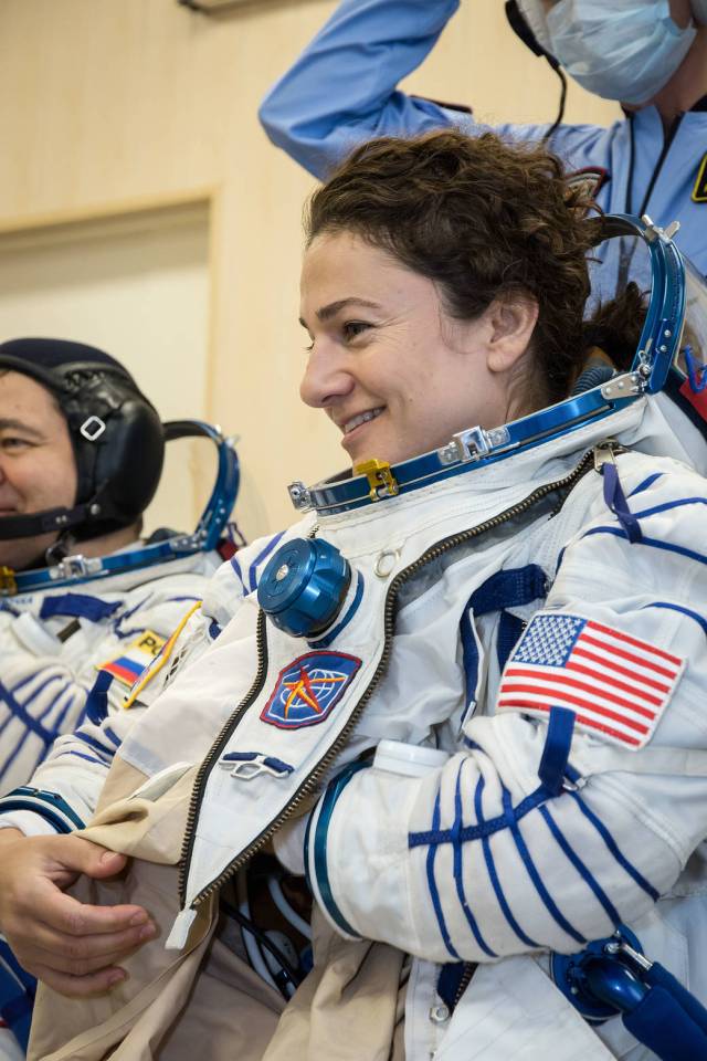 Jessica Meir suits up for a fit check aboard the Soyuz MS-15 spacecraft