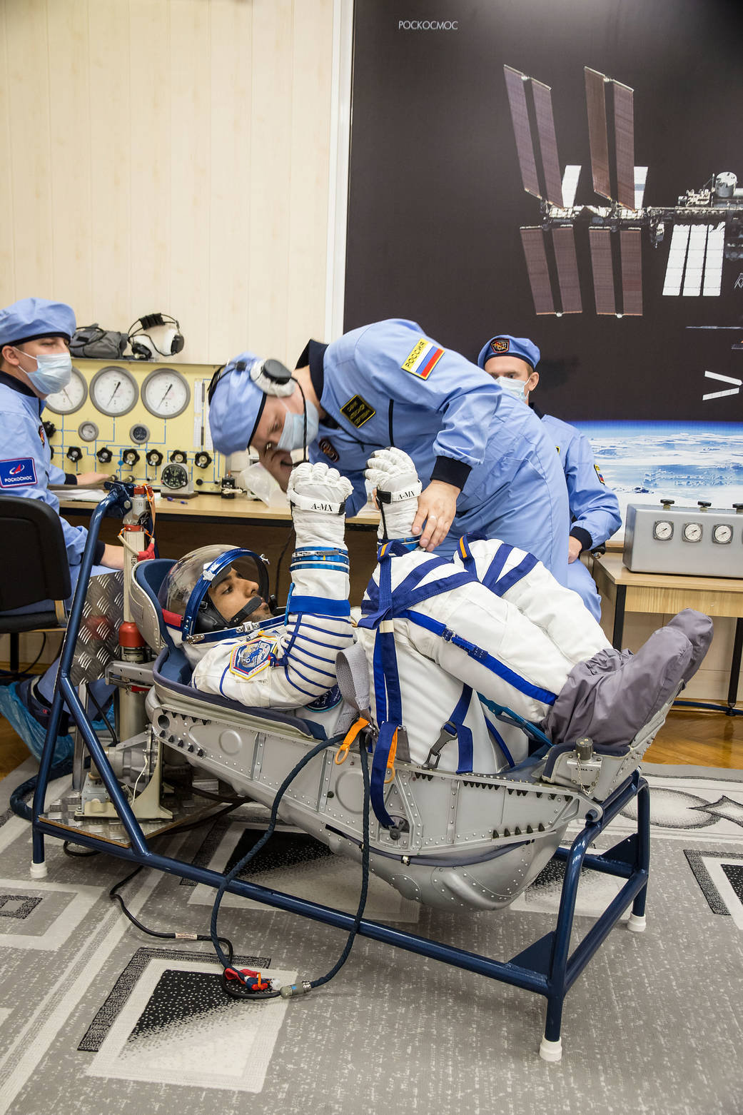 Hazzaa Ali Almansoor undergoes a pressure and leak check of his Russian Sokol launch and entry suit