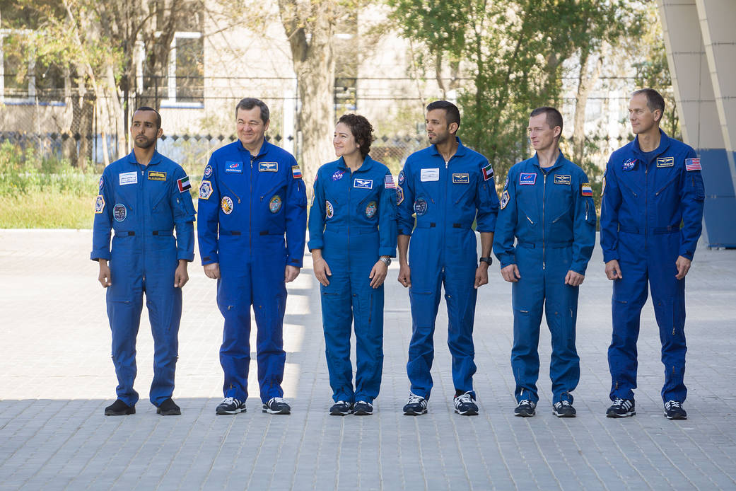 The prime and backup crewmembers for the next launch to the space station attend flag-raising ceremonies