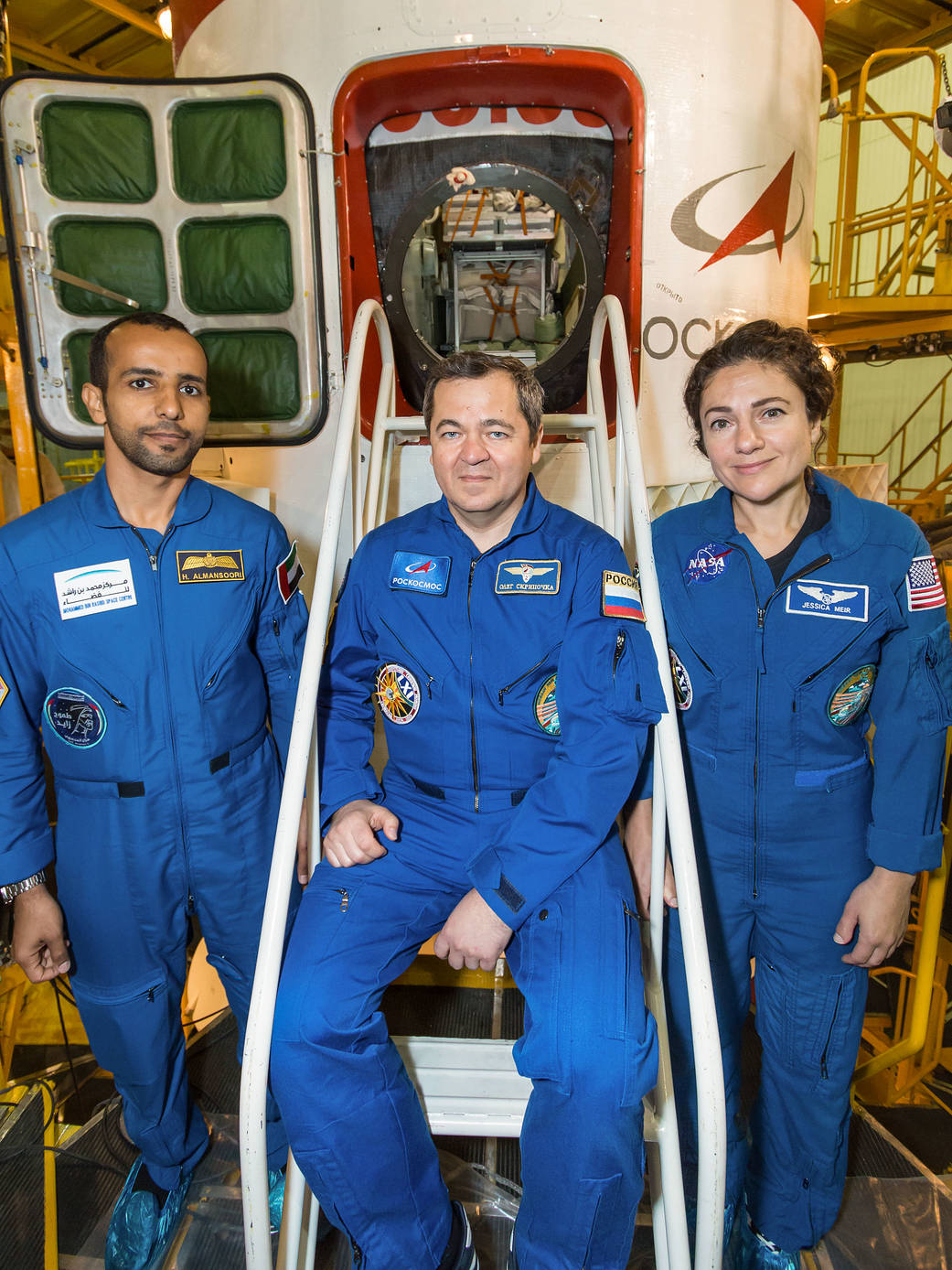 International Space Station crew poses in front of Soyuz spacecraft