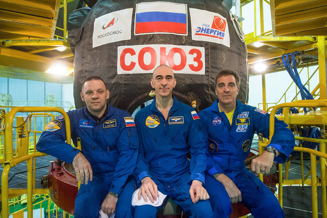Expedition 63 crewmembers in front of their Soyuz MS-16 spacecraft