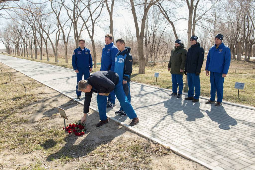 NASA astronaut Steve Bowen lays flowers