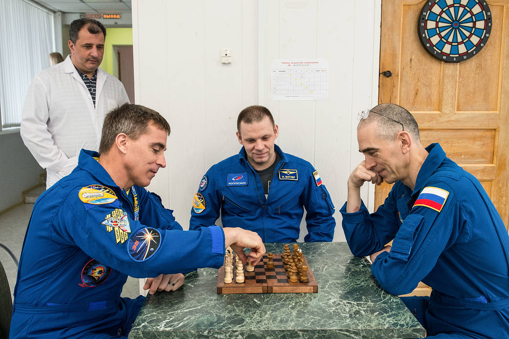 Expedition 63 crewmembers play a game of chess