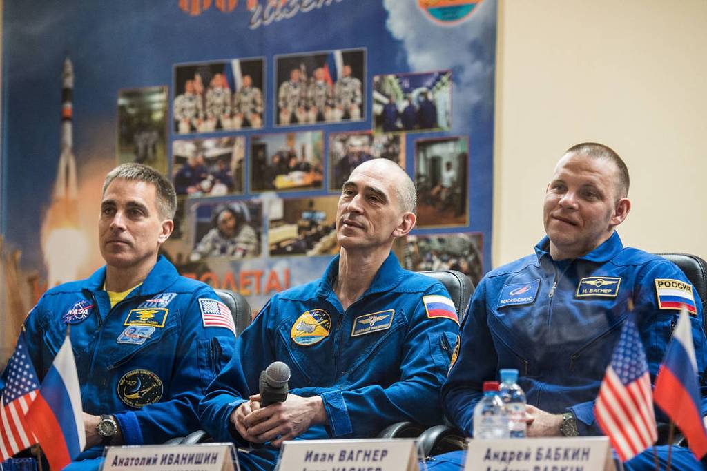 Expedition 63 crewmembers listen to questions provided by reporters