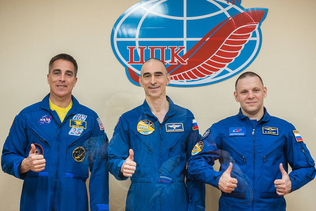 Expedition 63 crewmembers pose for pictures April 8