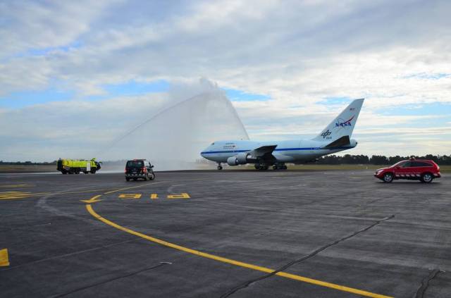 SOFIA receiving a water-arch salute from the Christchurch International Airport fire brigade after landing in New Zealand