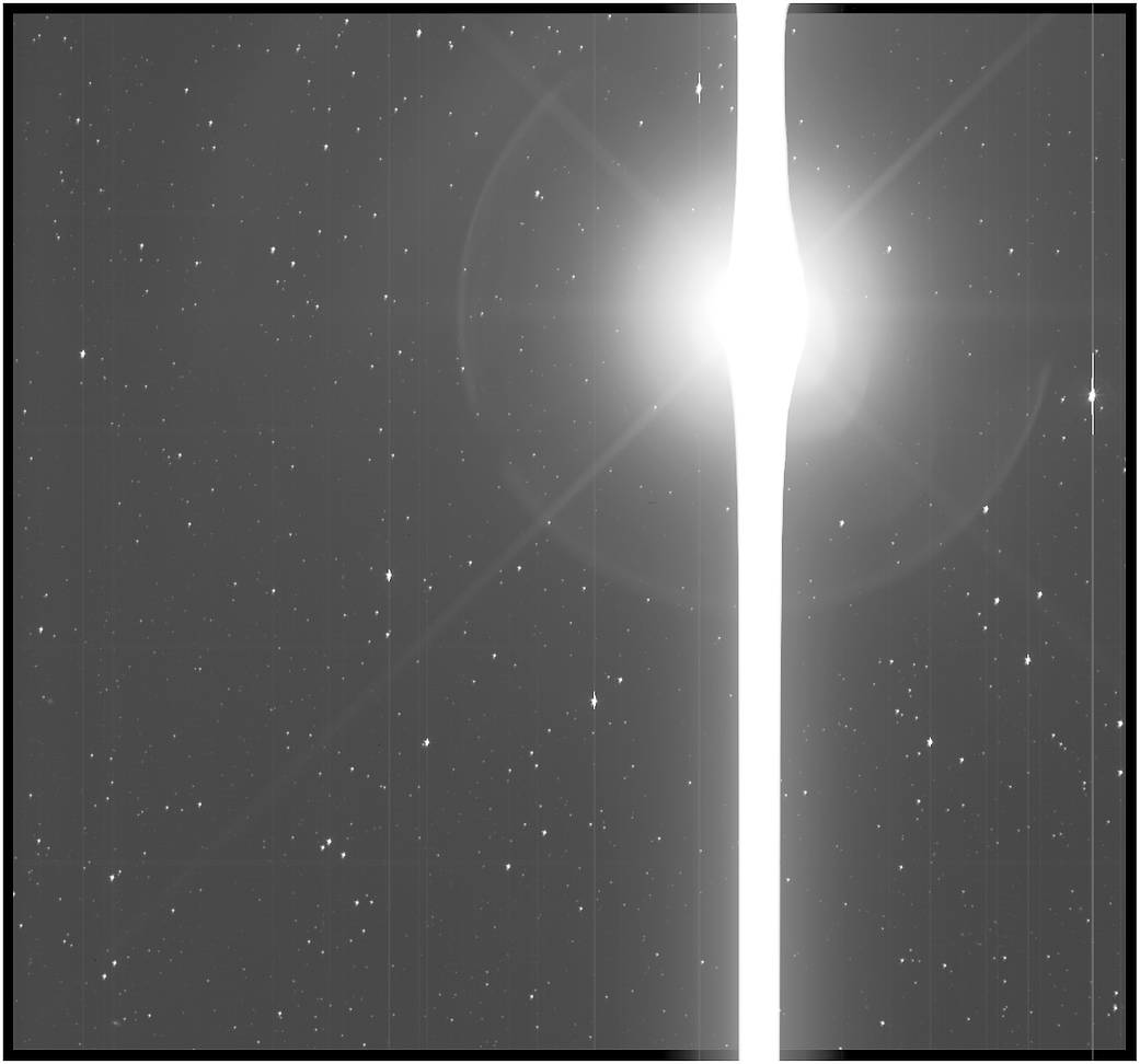 Kepler image of Earth, a saber-like saturation bleed across the instrument’s sensors