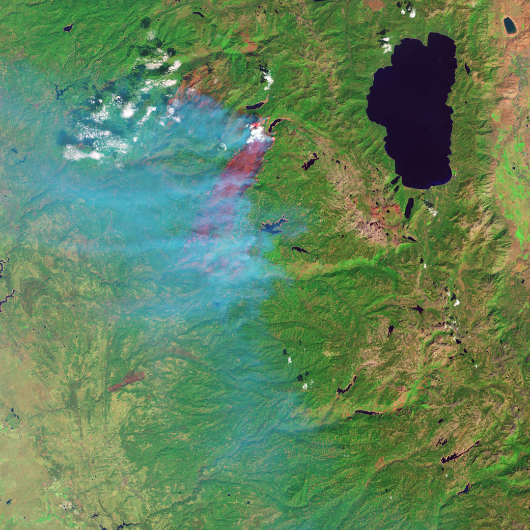 False color image of the King fire in Eldorado National Forest. Burned forest appears red; unaffected forests are green; cleared