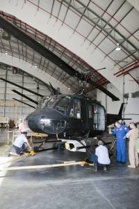 Near the Shuttle Landing Facility at NASA's Kennedy Space Center in Florida, a space agency team installed and tested hazard avoidance instrumentation on a Huey helicopter.