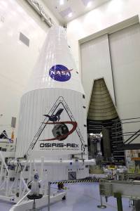 Inside the Payload Hazardous Servicing Facility at NASA's Kennedy Space Center in Florida, the agency’s OSIRIS-REx spacecraft is encapsulated in its payload fairing.