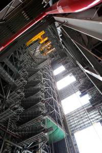 In the Vehicle Assembly Building at NASA’s Kennedy Space Center in Florida, a heavy-lift crane lowers the second half of the D-level work platforms, D north, for NASA’s Space Launch System (SLS) rocket, into position for installation in High Bay 3.