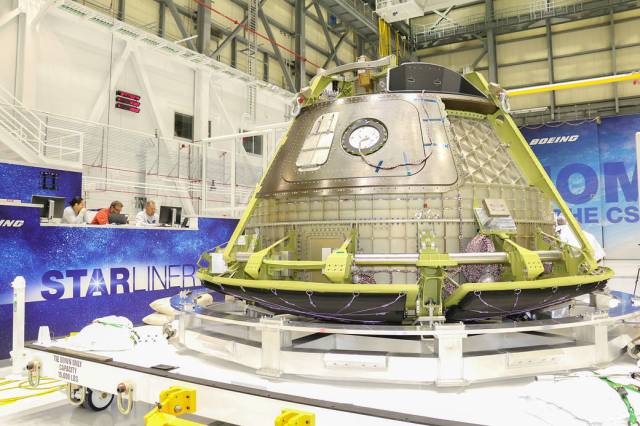 Boeing’s Structural Test Article of its CST-100 Starliner spacecraft is readied inside the company’s Commercial Crew and Cargo Processing Facility at NASA’s Kennedy Space Center. 