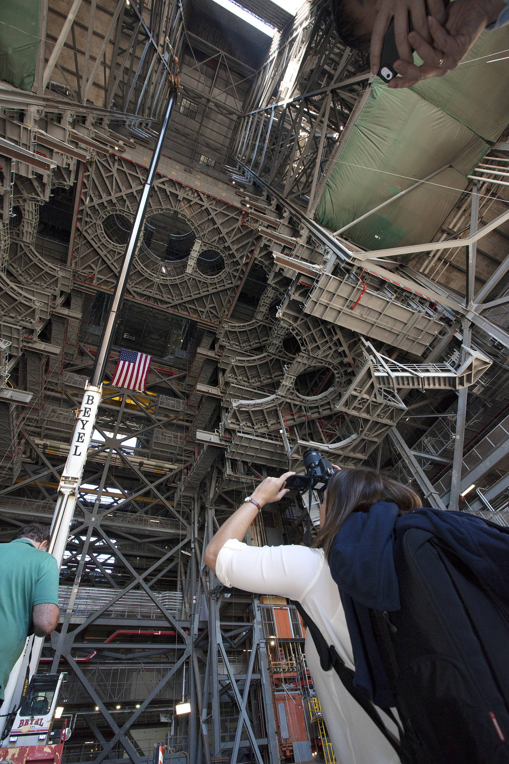 Members of the news media view the 10 levels of new work platforms in High Bay 3 inside the Vehicle Assembly Building (VAB) during a tour of NASA's Kennedy Space Center in Florida with Center Director Bob Cabana. 