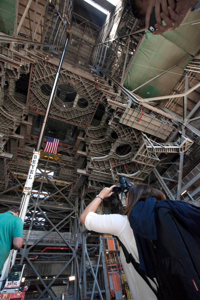 Members of the news media view the 10 levels of new work platforms in High Bay 3 inside the Vehicle Assembly Building (VAB) during a tour of NASA's Kennedy Space Center in Florida with Center Director Bob Cabana. 
