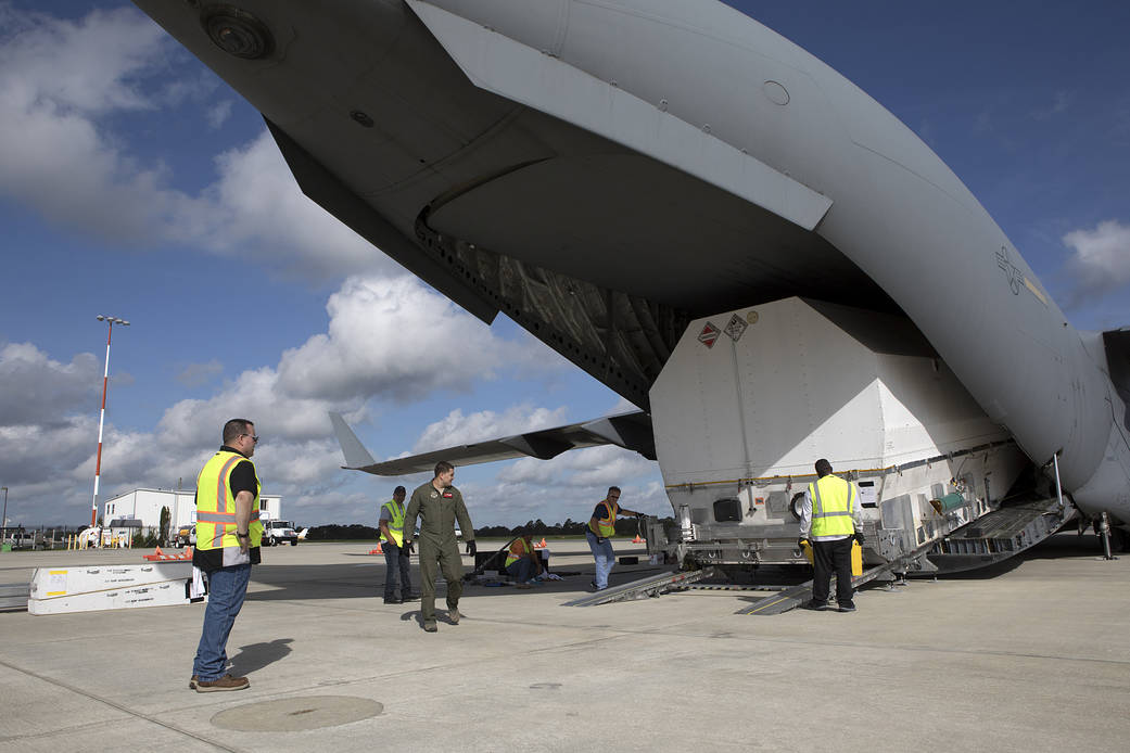 NASA's TDRS-M satellite arrives inside its shipping container in Titusville, Florida, aboard a U.S. Air Force transport aircraft