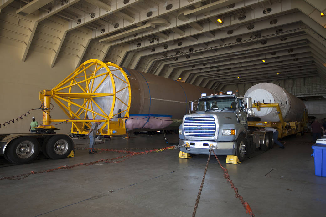 A United Launch Alliance Atlas V first stage and Centaur upper stage are unloaded from the Mariner ship at Port Canaveral, Fla.