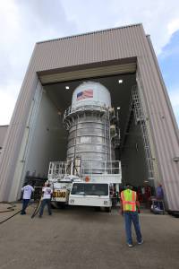 Packed inside its canister, the Interim Cryogenic Propulsion Stage (ICPS) for NASA's Space Launch System (SLS) rocket is moved into the low bay entrance of the Space Station Processing Facility at NASA's Kennedy Space Center in Florida.