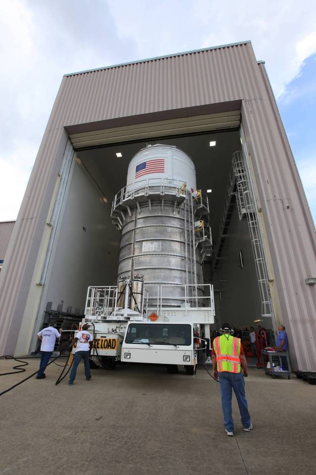 Packed inside its canister, the Interim Cryogenic Propulsion Stage (ICPS) for NASA's Space Launch System (SLS) rocket is moved into the low bay entrance of the Space Station Processing Facility at NASA's Kennedy Space Center in Florida. 