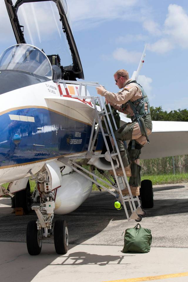 A NASA pilot boards an F-18 jet prior to take off from the agency's Shuttle Landing Facility at NASA's Kennedy Space Center in Florida. 