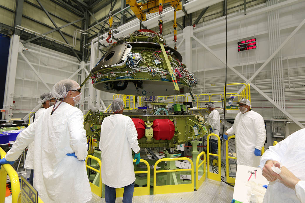 The upper and lower domes of the Boeing CST-100 Starliner Spacecraft 2 Crew Flight Test Vehicle were mated June 19, 2018, inside the Commercial Crew and Cargo Processing Facility (C3PF) at Kennedy Space Center in Florida.
