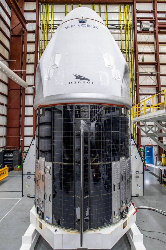 The SpaceX Crew Dragon spacecraft for NASA’s SpaceX Crew-1 mission is photographed inside the SpaceX Hangar at Kennedy Space Center in Florida following its arrival.