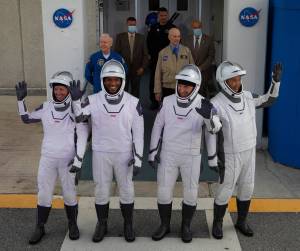 The NASA SpaceX Crew-1 astronauts emerge from the Neil Armstrong Operations and Checkout Building at NASA’s Kennedy Space Center in Florida on Nov. 15, 2020.