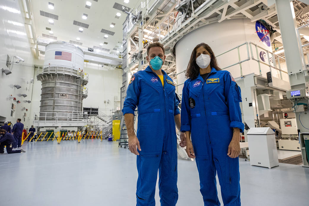 NASA astronauts Josh Cassada, left, and Suni Williams tour Artemis I flight hardware at Kennedy Space Center.
