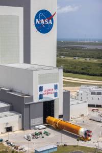 Teams with Exploration Ground Systems and lead contractor Jacobs transport the massive Space Launch System core stage to Kennedy's Vehicle Assembly Building following its arrival.